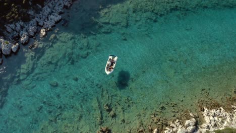 Greece-Tourists-on-Boat-Relaxing-in-Tropical-Mediterranean-Sea-Lagoon