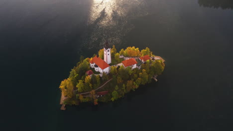 Revealing-tilting-up-drone-shot-of-the-Pilgrimage-Church-of-the-Assumption-of-Mary,-Slovenia