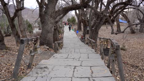 Muktinath,-Nepal---November-20,-2021:-People-walking-on-the-path-up-to-the-Muktinath-Temple-in-the-lower-Mustang-Region-of-Nepal