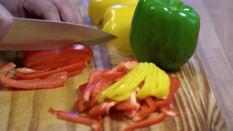 slicing-bell-peppers-in-julienne-on-wooden-board-kitchen-healthy-healthy-diet