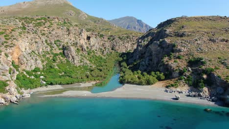 Aerial-shot-flying-towards-the-spectacular-Preveli-beach-on-the-island-of-Crete