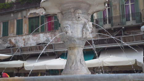Slowly-passing-the-Cansignorio-sculpted-base-of-the-Fountain-of-Madonna-Verona,-Italy,-slow-motion