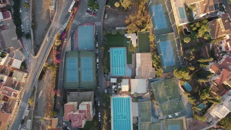 Aerial-top-down-view-during-sunset-of-a-sports-complex-in-Candado-Beach,-Spain-in-the-middle-of-the-city