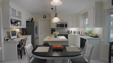 Gimbal-shot-of-and-empty-white-kitchen-in-the-suburbs
