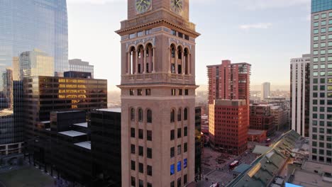 Drone-Aerial-View-Flying-Up-Showing-Lannies-Clocktower-Landmark-Structure-In-Downtown-Denver-Colorado-During-Golden-Hour-Sunset