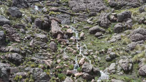 pampas-galeras-waterfall-among-rock-cliff-Apurimac,-Peru