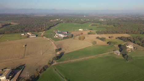Llagostera-comarca-de-la-Selva-aerial-view-with-drone-cultivated-field-Spain