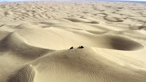 Aerial-tracking-over-ATV's-in-the-Imperial-Sand-Dunes,-Glamis,-California