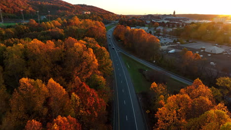 Aerial-drone-flight-above-highway-during-incredible-light-at-sunset