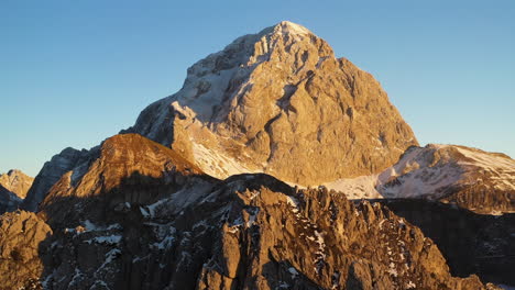 Revealing-drone-shot-of-the-Mangart-mountain-in-the-Julian-Alps,-Slovenia