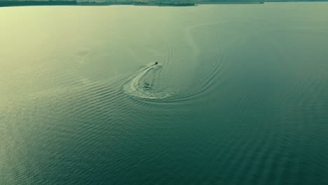 Aerial-view-showing-driving-jet-ski-on-endless-sea-in-summer,slow-motion-shot