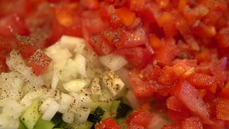 Chopped-Tomatoes,-Onions,-And-Cucumber-Seasoned-With-Black-Pepper---close-up