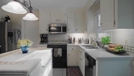 Gimbal-shot-of-and-empty-white-kitchen-in-the-suburbs