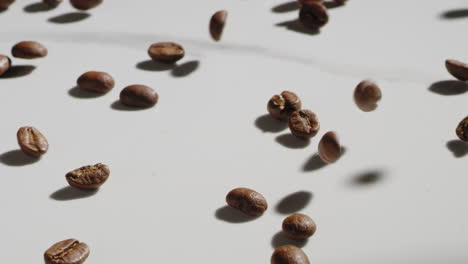 coffee-beans-sliding-and-bouncing-off-of-a-counter-top