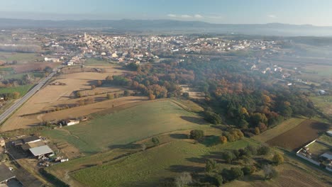 Llagostera-comarca-de-la-Selva-aerial-view-with-drone-cultivated-field-Spain