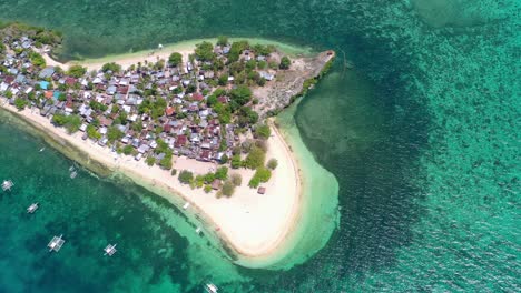 High-aerial-drone-view-of-inhabited-green-sand-spit-of-Palawan-island-in-the-Philippines