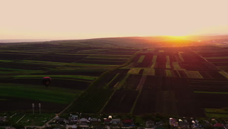 Cinematic-shot-in-Republic-of-Moldova,-Magdacesti-village,-hot-air-balloon-in-the-evening