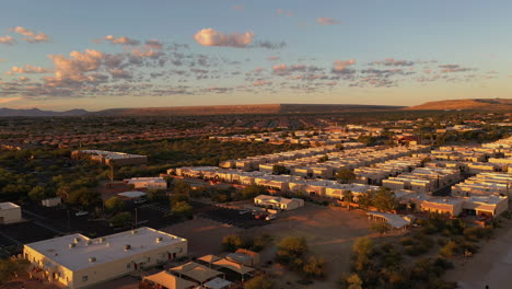 Green-Valley-Arizona,-townhomes-and-houses-at-sunrise,-drone-ascending