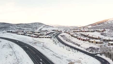 Real-Estate-Property-by-Highway-Road-in-Snowy-Mountains-of-Park-City,-Utah