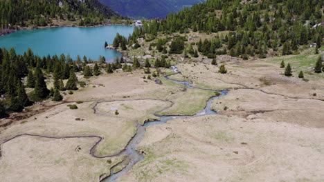 Aerial-View-of-Mountain-Water-Stream-and-Natural-Mountain-Lake