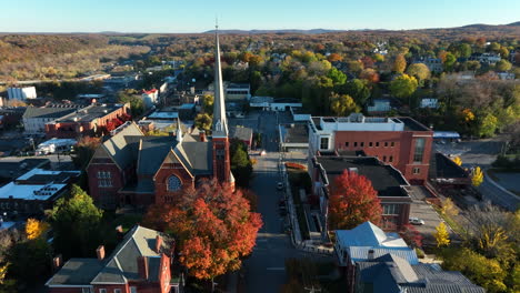 Aerial-establishing-shot-of-town-in-USA-during-autumn-fall-foliage