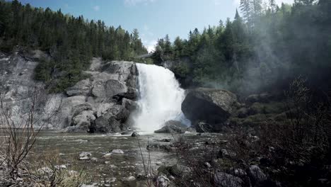 Wonderful-View-Of-A-Waterfall-And-Forest-In-Chute-Neigette-Rimouski-Quebec---tilted-shot