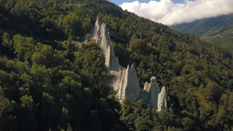 Rotating-drone-shot-around-the-Pyramides-of-D'Euseigne-at-Val-D'Herens-in-Switzerland-in-4k