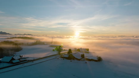 Local-Farm-Houses-Shrouded-With-Winter-Fog-During-Sunset-In-Vaud,-Switzerland