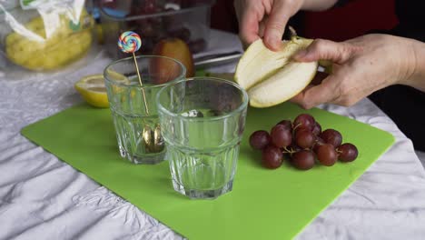 Peeling-a-banana-to-make-a-fruit-breakfast,-side-view