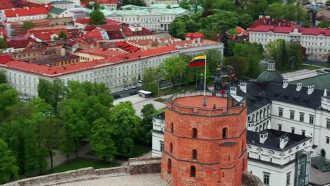 Lithuanian-Flag-Waving-In-The-Wind-At-Gediminas-Castle-Tower-In-Vilnius-Old-Town,-Lithuania