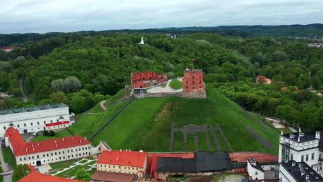 Aerial-View-Of-Gediminas-Hill-And-Tower-Castle-With-Dense-Trees-Background-In-Vilnius,-Lithuania
