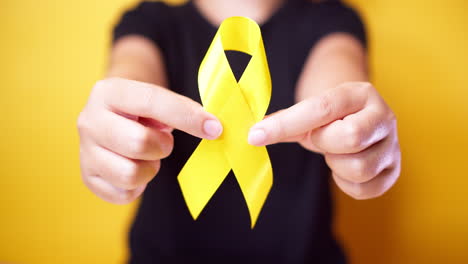 Suicide-prevention-day,-Sarcoma,-bone,-bladder-and-Childhood-cancer-Awareness-month,-Yellow-Ribbon-for-supporting-people-living-and-illness