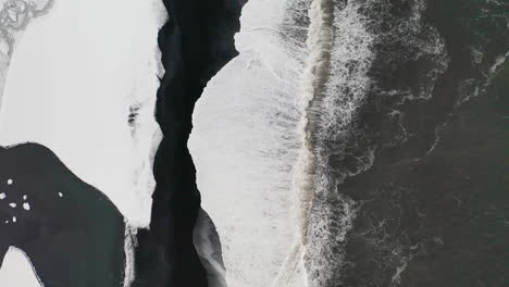 The-beautiful-black-beach-in-South-Iceland-during-the-winter---aerial