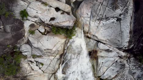 Aerial-Top-Down-View-Of-Emerald-Creek-Falls-With-Water-Cascading-Down-Rock-Face