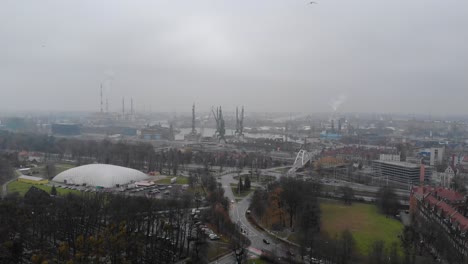 Aerial-panorama-of-Gdansk-city-and-harbor-on-cloudy-day,-industrial-district