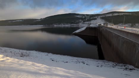 Hydroelectric-Power-Plant-Idyllic-Snowy-Day,-Pan