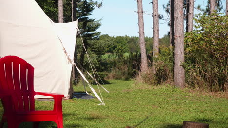 A-green-lawn-is-lying-in-front-of-a-camping-tent
