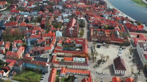 Aerial-View-Over-Red-Roofs-Of-Kaunas-City-In-Lithuania---drone-shot