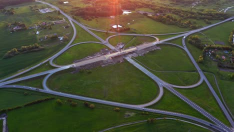 European-Route-E-67,-Aerial-View-Of-Cars-Driving-At-Baltic-Way-At-Dusk-Near-Panevezys-In-Lithuania