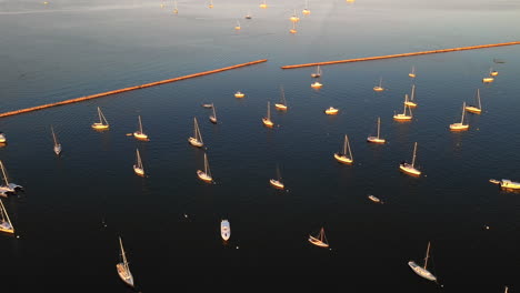 Aerial-View-Of-Sailboats-At-Sunset-In-The-Hamptons,-New-York
