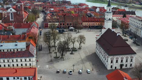 Kaunas-City-Hall-With-Nemunas-River,-Kaunas-Old-Town-In-Lithuania---aerial-drone-shot