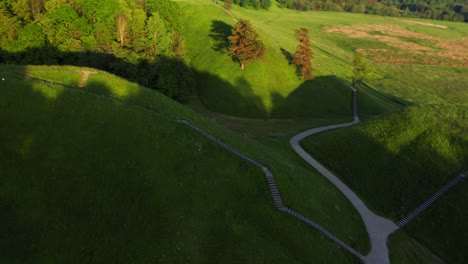 Hills-of-Kernave,-Tourist-Attraction-and-an-Archaeological-Site-in-Lithuania---aerial-drone-shot