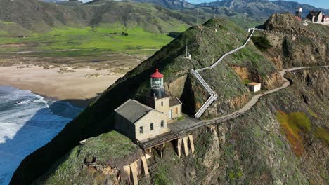 Aerial-cinematic-shot-of-Point-Sur-Lighthouse-on-Cliff-in-Big-Sur-Highway-1,-California
