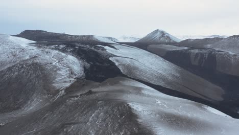 Black-solid-lava-basalt-on-surface-of-mountain-slope-in-Iceland-landscape,-Geldingadalsgos