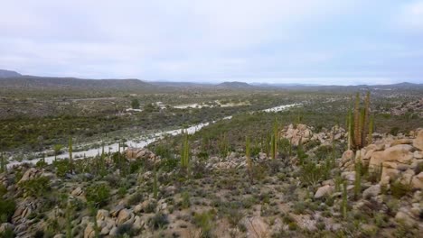 Aerial-view-over-the-Catavina-desert,-partly-sunny-day,-in-Mexico---dolly,-drone-shot