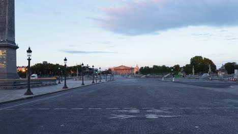 Place-de-la-concorde-empty-street-during-early-morning-with-nobody-in-Paris,-wide-truck-shot