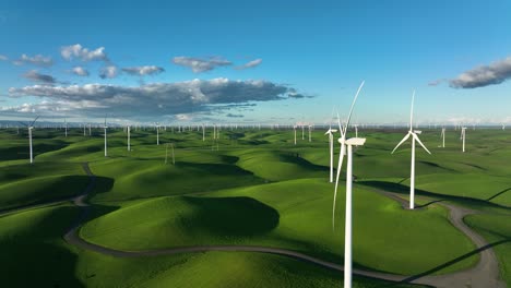 Wind-Turbine-Farm-propellers-spinning-is-slow-motion,-Green-rolling-hills-blue-sky,-Montezuma-Hills,-California