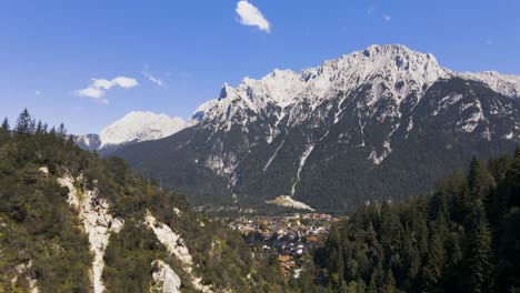 Aerial-view-across-the-valley-to-a-mountain-village