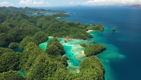 Breathtaking-Nature-of-Philippines,-Aerial-View-of-Siargao-Island-Exotic-Lagoon-Turquoise-Sea-and-Green-Rainforest-on-Coastline