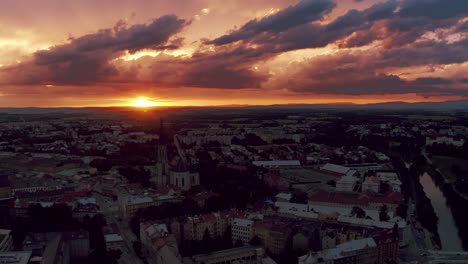 City-of-Olomouc-at-red-sunset,-aerial-drone-shot